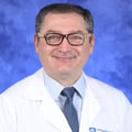 DeFlitch Headshot White Coat 2021